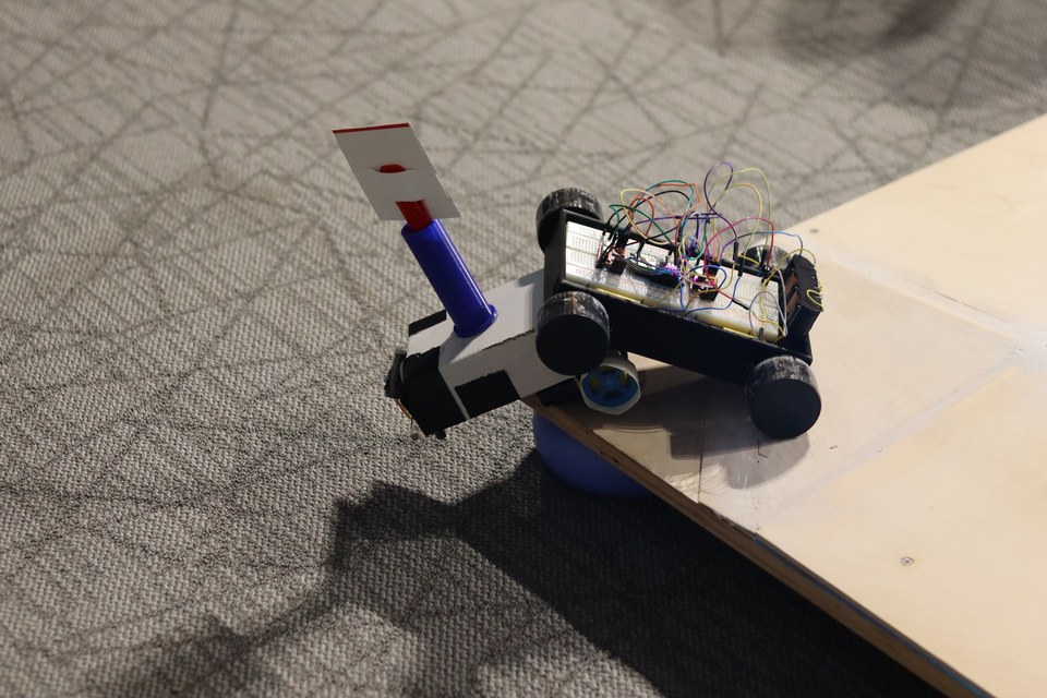 Two student-built sumobots one about to go in for the kill.