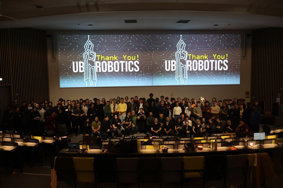 A large UBRobotics group gathered in front of the event stage.